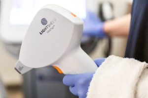 Another angle of the provider's gloves and the LightSheer DESIRE laser applicator for laser hair removal in Rogers, AR